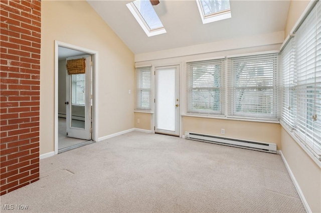 unfurnished sunroom with baseboard heating and vaulted ceiling with skylight