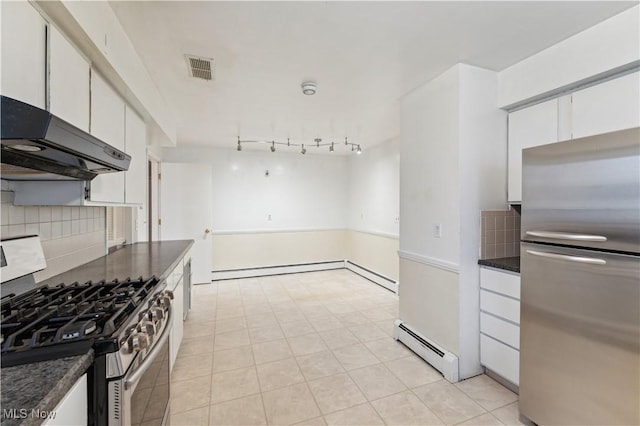 kitchen featuring decorative backsplash, white cabinetry, appliances with stainless steel finishes, and a baseboard radiator