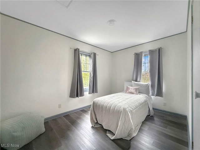 bedroom featuring dark hardwood / wood-style flooring