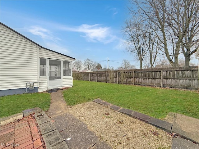 view of yard with a sunroom