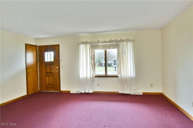 carpeted empty room featuring a healthy amount of sunlight