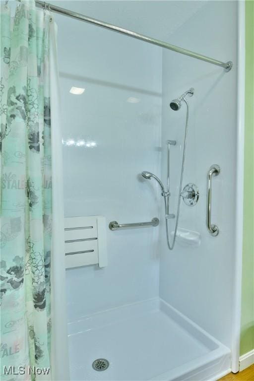 bathroom with a shower with curtain