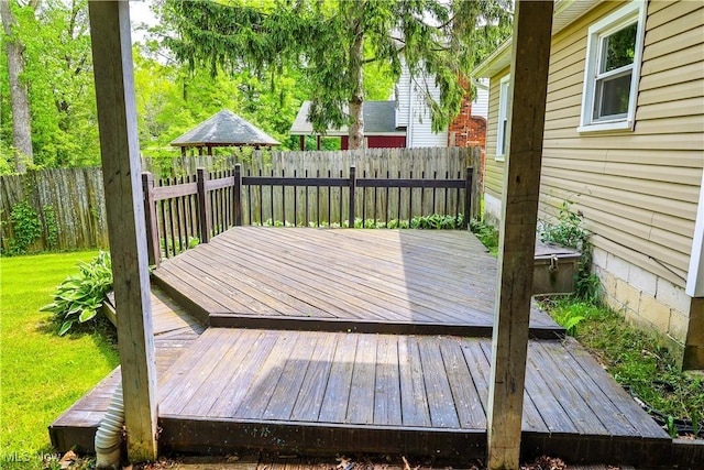 deck with a gazebo and a yard