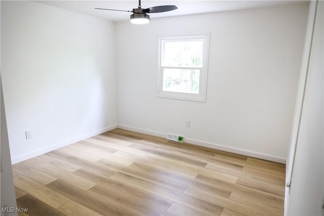 unfurnished room with light wood-type flooring and ceiling fan