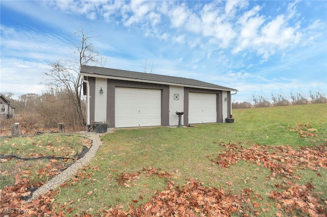 garage featuring a yard