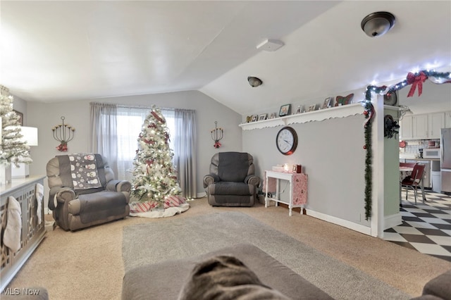 carpeted living room with lofted ceiling