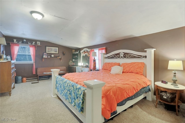 bedroom featuring carpet and lofted ceiling