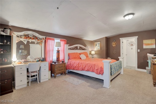 carpeted bedroom featuring lofted ceiling