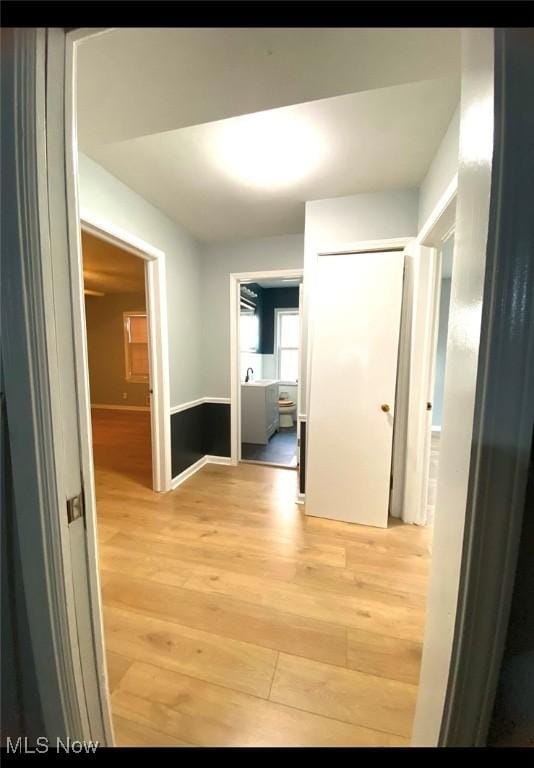 corridor featuring light hardwood / wood-style flooring