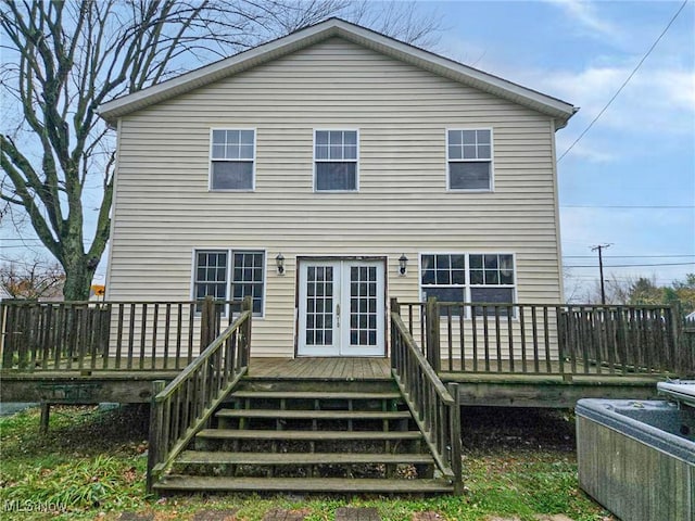 back of house with french doors and a deck