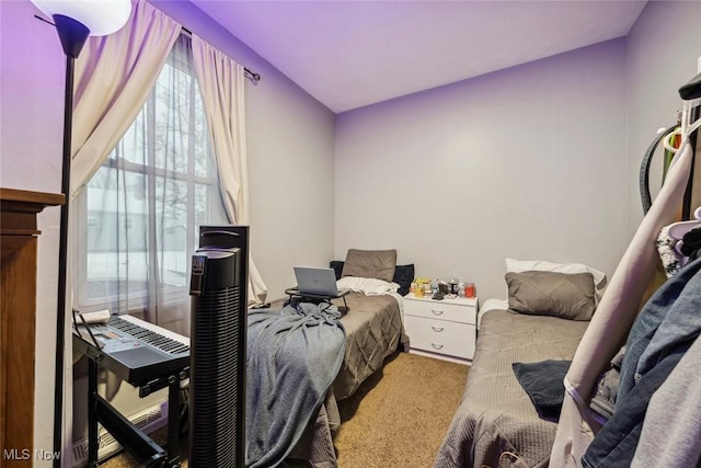 carpeted bedroom with lofted ceiling