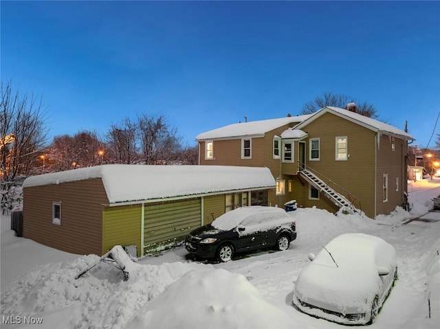 view of snow covered house