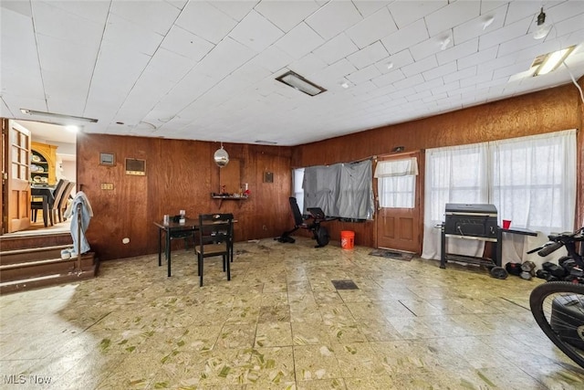 interior space featuring wood walls