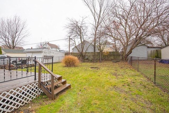 view of yard featuring a wooden deck