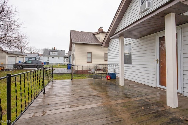 wooden terrace featuring a yard