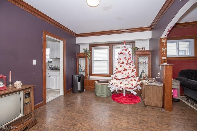 interior space featuring crown molding and hardwood / wood-style flooring