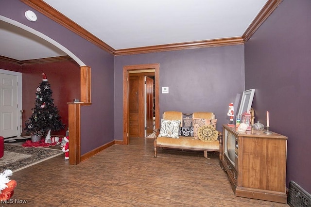 hallway with wood-type flooring and ornamental molding