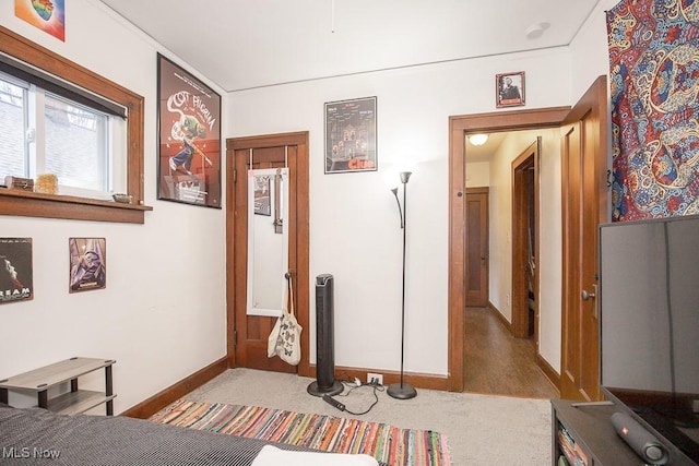 corridor featuring hardwood / wood-style floors