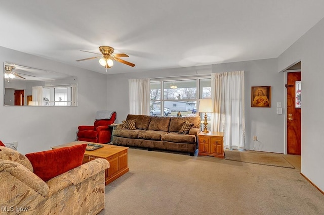 living room with carpet flooring and ceiling fan