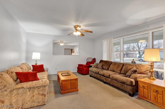 living room featuring ceiling fan and light carpet