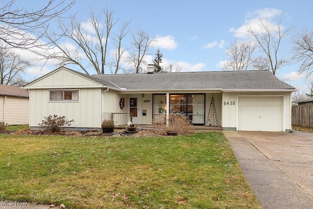 single story home with a front lawn and a garage