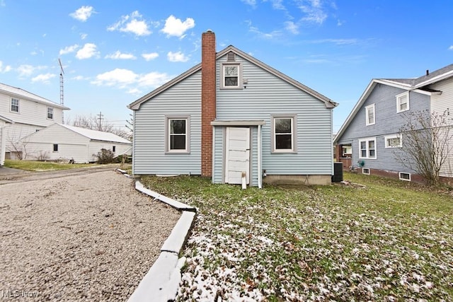 back of house with a yard and cooling unit