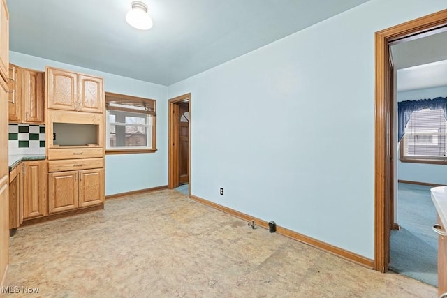 kitchen with light carpet