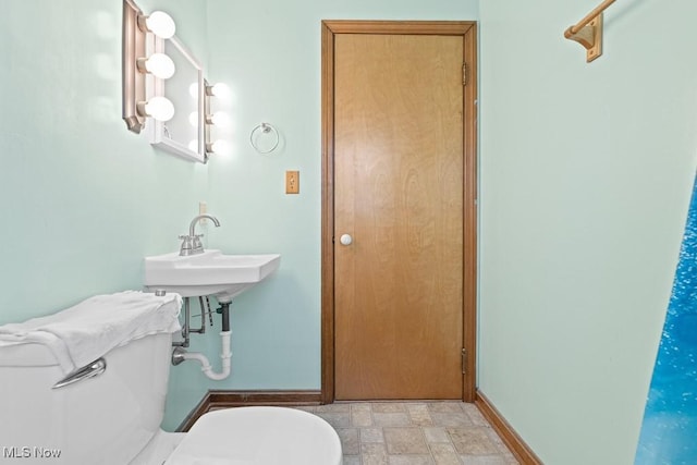 bathroom with toilet and sink