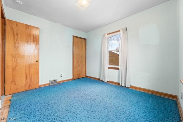 spare room featuring carpet flooring