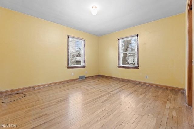 empty room with light wood-type flooring