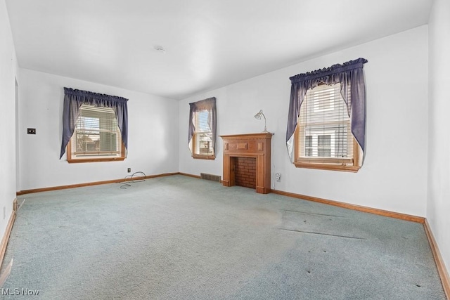 unfurnished living room featuring carpet floors