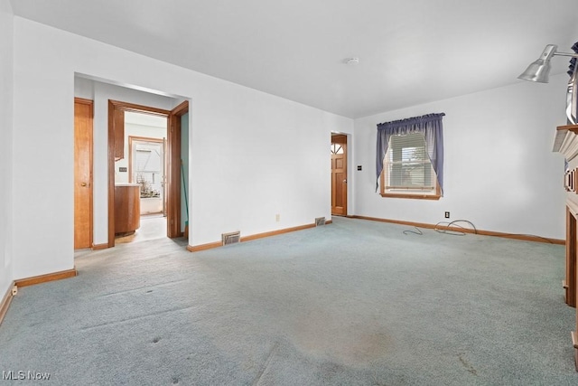 unfurnished room featuring carpet flooring