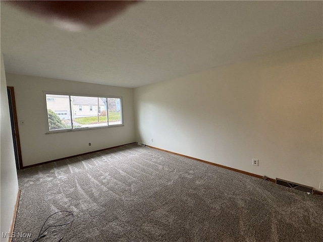 empty room featuring carpet flooring