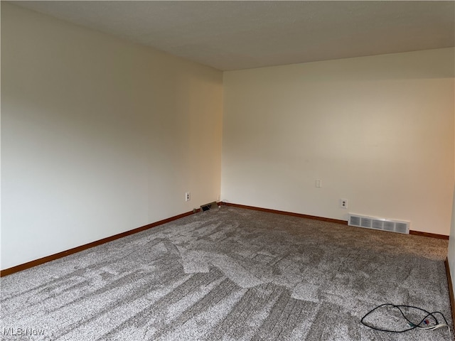 spare room featuring carpet