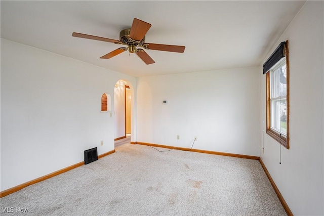 unfurnished room with carpet and ceiling fan