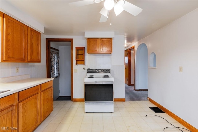 kitchen featuring white electric range oven and ceiling fan