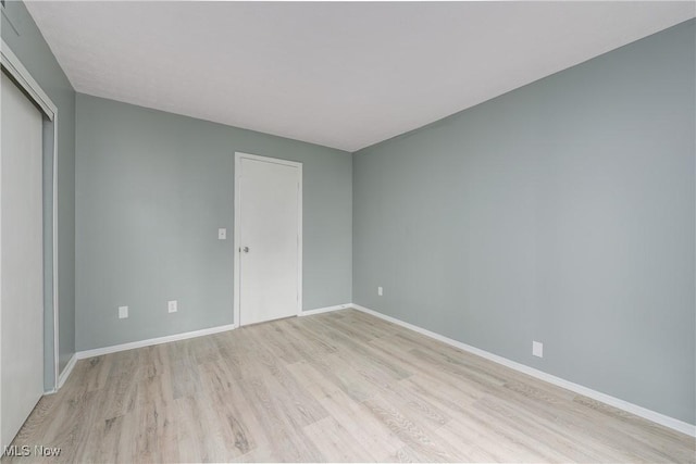 spare room with light hardwood / wood-style floors