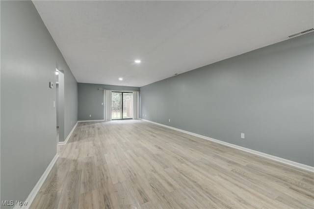 unfurnished room with light hardwood / wood-style floors