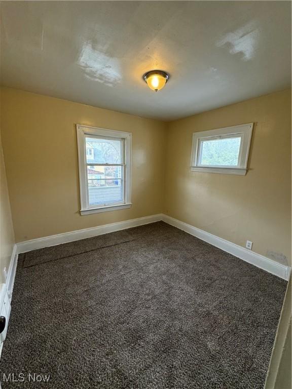 unfurnished room with carpet floors