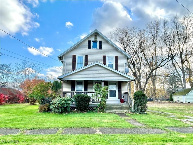 view of front of property featuring covered porch and a front yard