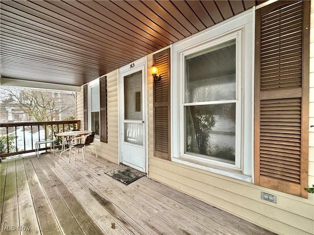 wooden terrace featuring a porch