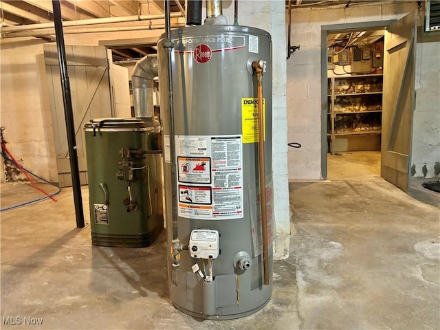 utility room featuring water heater and gas water heater