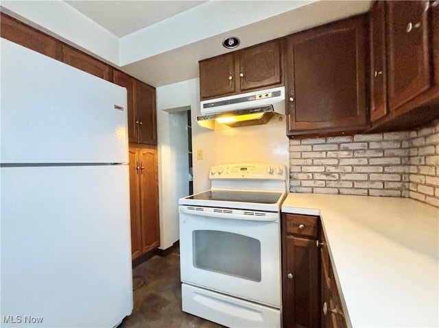 kitchen with white appliances and tasteful backsplash