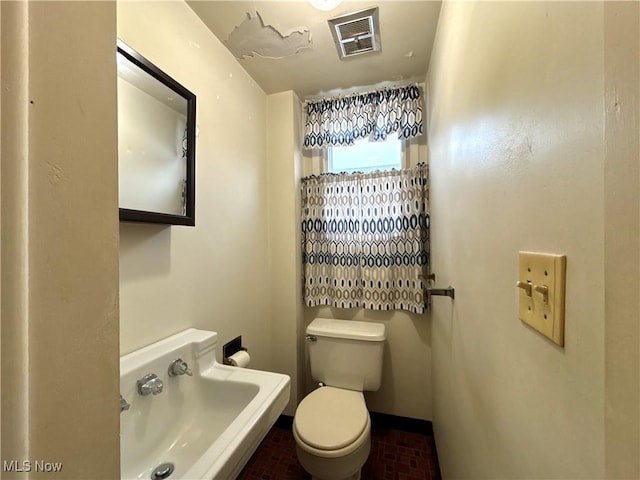 bathroom featuring toilet