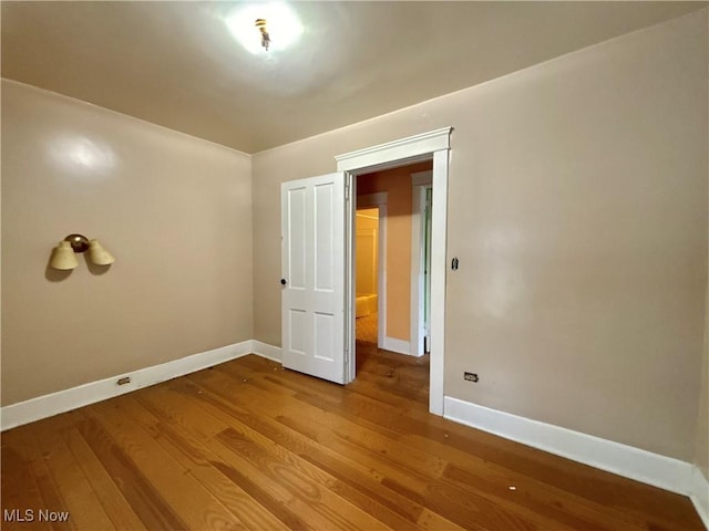 empty room featuring hardwood / wood-style floors