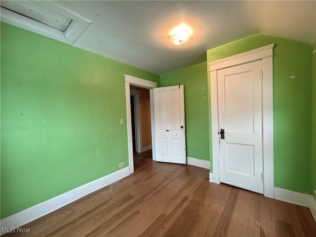 unfurnished bedroom with hardwood / wood-style floors