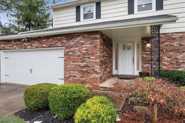 doorway to property featuring a garage