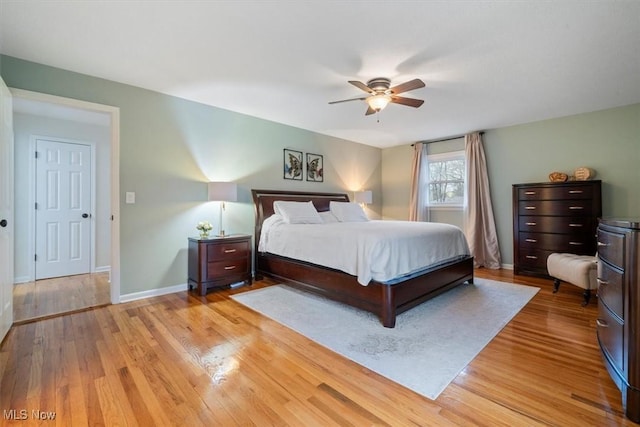 bedroom with ceiling fan and light hardwood / wood-style flooring