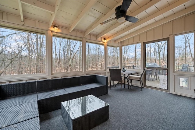 unfurnished sunroom featuring lofted ceiling with beams, ceiling fan, and wood ceiling