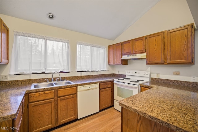 kitchen with light hardwood / wood-style floors, white appliances, sink, and vaulted ceiling